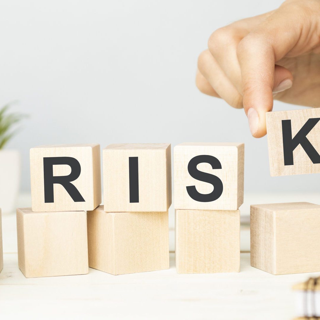 Wooden blocks spelling Risk